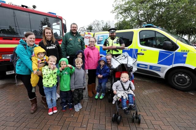 The Etheridge, Mascia, Holmes and Walton families with members of the emergency services Picture: Chris Moorhouse