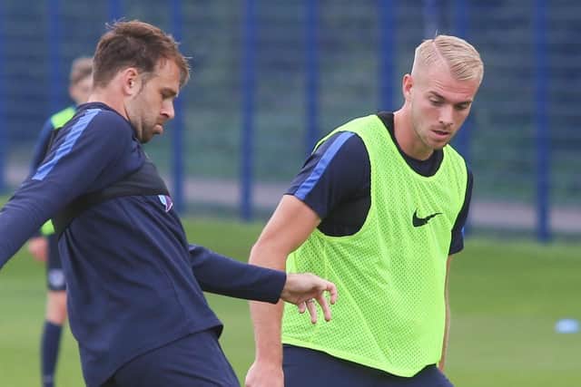 Jack Whatmough, right, and Brett Pitman. Picture: Habibur Rahman