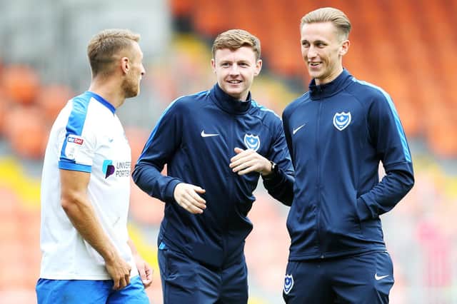 Dion Donohue (centre) has yet to play for Pompey this season. Picture: Joe Pepler