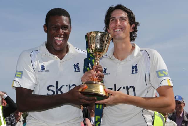 Keith Barker celebrates Warwickshire's County Championship title in 2012 with former Hampshire youngster Chris Wright, who will join Leicestershire next season