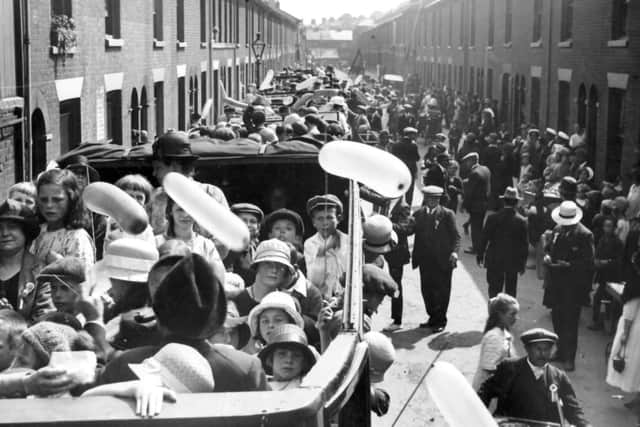Leaving in a fleet of charabancs we see children on a day out after the Portsmouth street traders won 100.