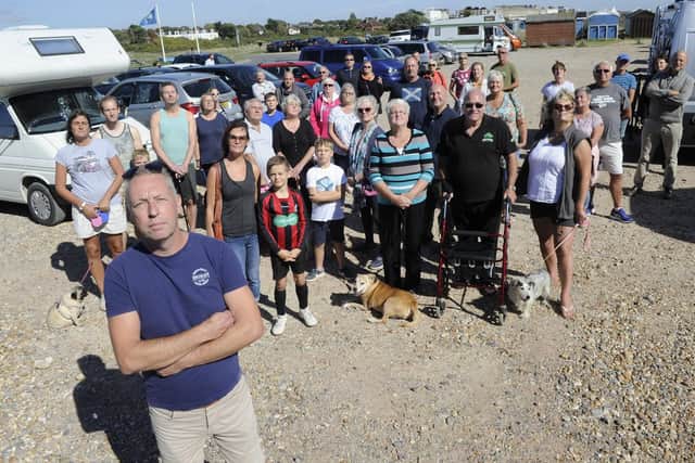 Motorhome owners, including Simon Jones, front-left, pictured at the Beachlands West car park. Picture: Ian Hargreaves
