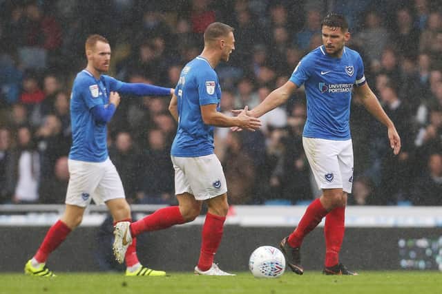 Gareth Evans, right, high-fives Lee Brown. Picture: Joe Pepler