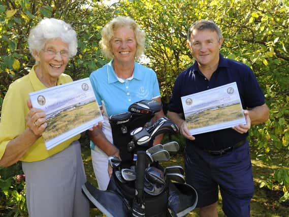 From left - Helen Rees, Viv Fitch and Bill John with the new book detailing the history of Hayling Island's ladies golf club