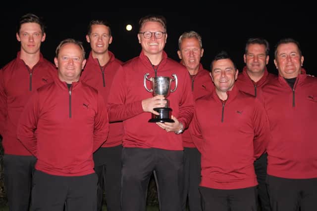 Rowlands Castle celebrate their Hampshire Sevens win. Left to right: Mark Ostram, Phil Russell, Phil Hodgson, James Hawley (captain), Simon Ostram, Jamie Turnball, Paul Whiteaway, and Glynn Catterall. Picture: Andrew Griffin