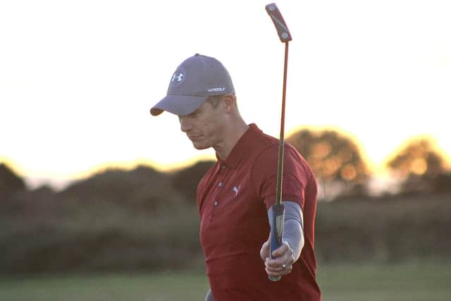 Rowlands Castle's Phil Hodgson holes the winning putt against Royal Jersey. Picture: Andrew Griffin