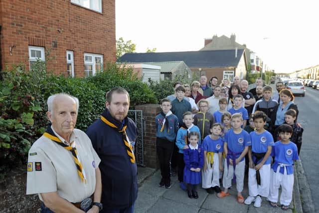 Youth groups and users of St Nicholas Church in Copnor protest at plans to knock down the vicarage and church hall for re-developement. At the front, Martin Lewis, left, and Liam Buckland of 61st Portsmouth Scouts.
Picture Ian Hargreaves  (180925-1_church)