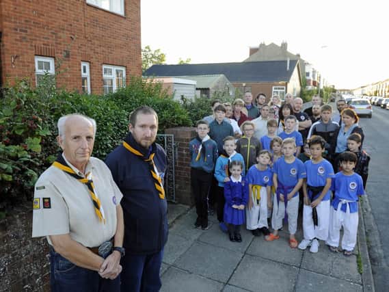 Youth groups and users of St Nicholas Church in Copnor protest at plans to knock down the vicarage and church hall for re-developement. At the front, Martin Lewis, left, and Liam Buckland of 61st Portsmouth Scouts.
Picture Ian Hargreaves  (180925-1_church)