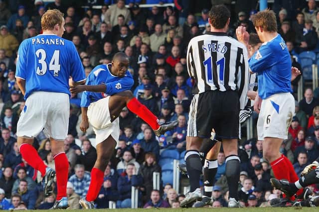 Lomana Lualua scores against Newcastle in 2004. Picture: Mike Hewitt/Getty Images