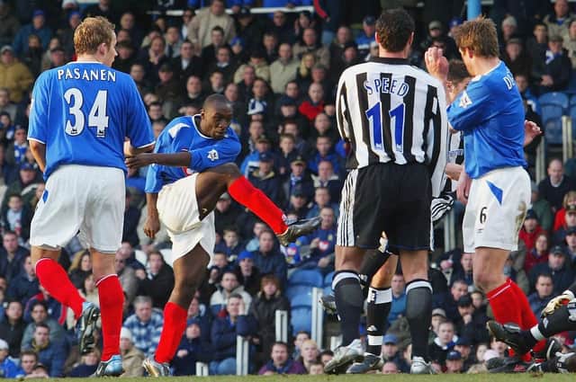 Lomana Lualua scores against Newcastle in 2004. Picture: Mike Hewitt/Getty Images