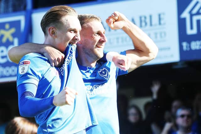 Ronan Curtis celebrates with Pompey team-mate Lee Brown Picture: Joe Pepler