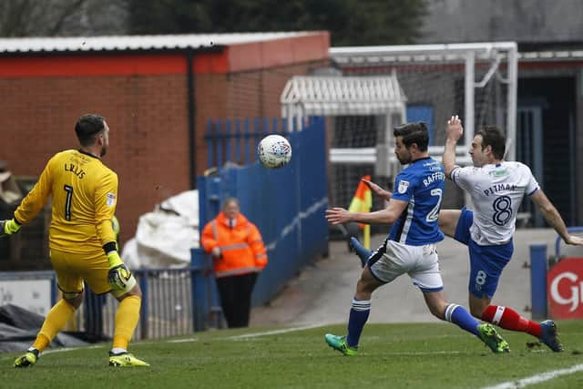 Pompey striker Brett Pitman scoring against Rochdale last season. Picture: Daniel Chesterton