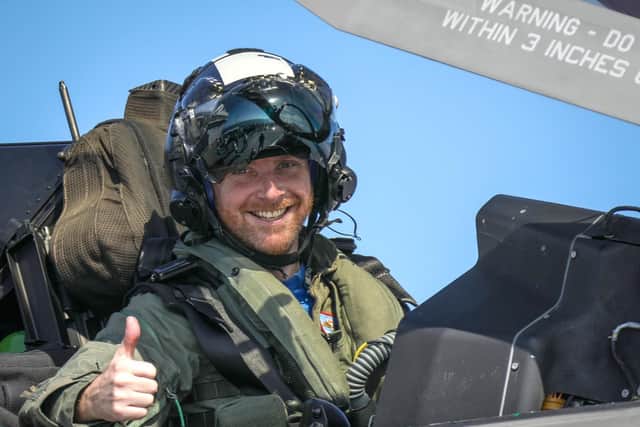 Pictured: Commander Nathan Gray RN, gives the thumbs up after making the first ever F-35B Lightning II jet vertical landing onboard HMS Queen Elizabeth.