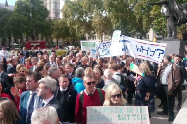 Hampshire headteachers gather in Parliament Square under the country's flag to commence the march to Downing Street. Picture: Neil Fatkin