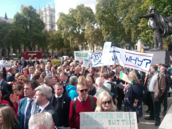 Hampshire headteachers gather in Parliament Square under the country's flag to commence the march to Downing Street. Picture: Neil Fatkin