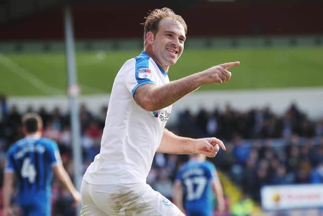 Brett Pitman celebrates his goal in Pompey's impressive win at Rochdale Picture: Joe Pepler