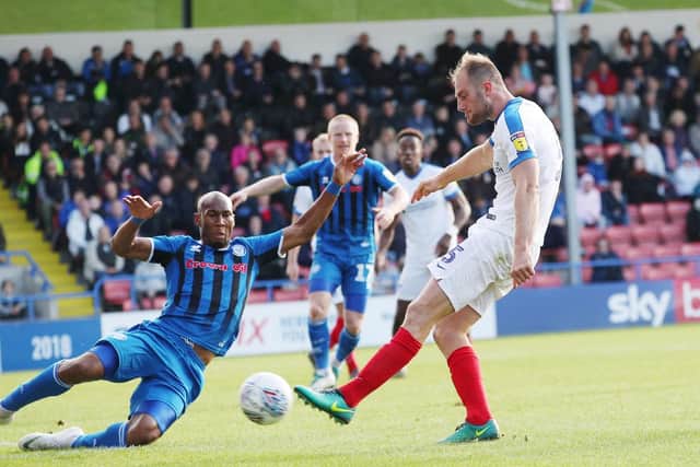 Matt Clarke rifles home Pompey's third goal in their 3-1 Spotland triumph. Picture: Joe Pepler