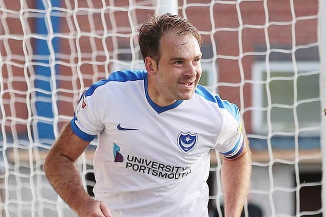 Brett Pitman celebrates marking his 50th Pompey appearance with the second goal in Saturday's 3-1 win over Rochdale. Picture: Joe Pepler