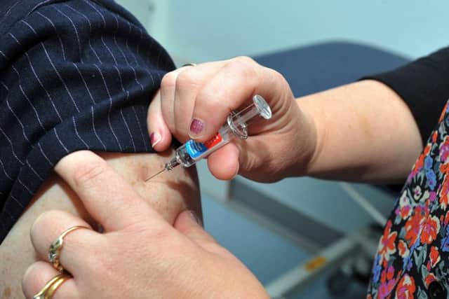 People are being urged to get the flu vaccine as soon as possible