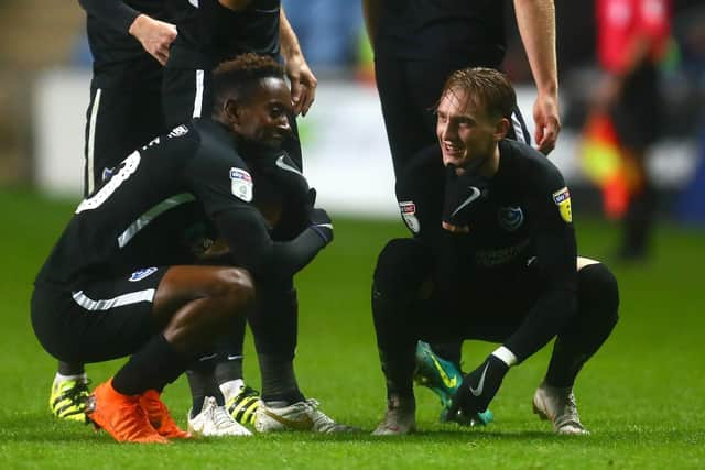 Ronan Curtis, right, celebrates his Pompey match-winner at Coventry with Jamal Lowe. Picture: Phillip Oldham