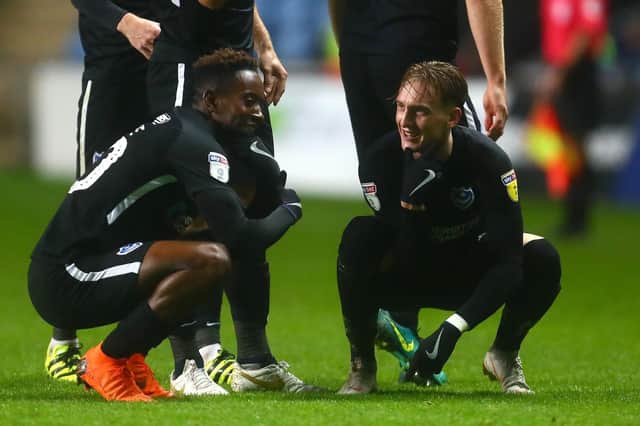 Ronan Curtis, right, celebrates his Pompey match-winner at Coventry with Jamal Lowe. Picture: Phillip Oldham