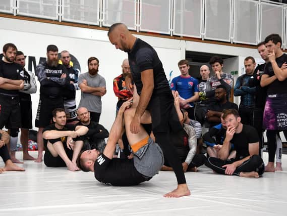 Craig Jones imparts his Brazilian jiu-jitsu wisdom at Gym 01. Picture: Neil Marshall