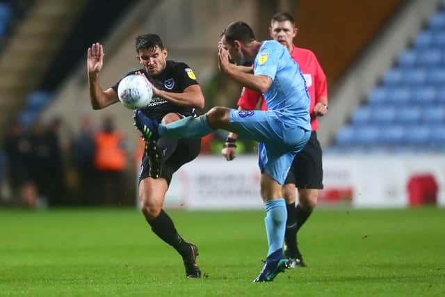Pompey's Gareth Evans battles Coventry skipper Michael Doyle for the ball. Picture: Philip Oldham
