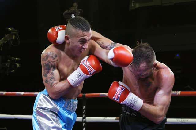 Micky McKinson, left, on his way to victory over Colin Lynes at the Mountbatten Centre. Picture: Neil Marshall (171340-3)
