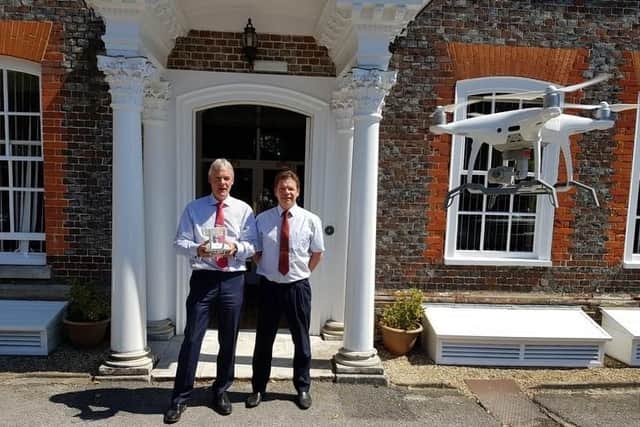 Chris Daniells, left, alongside Richard Huffer and their company's drone
