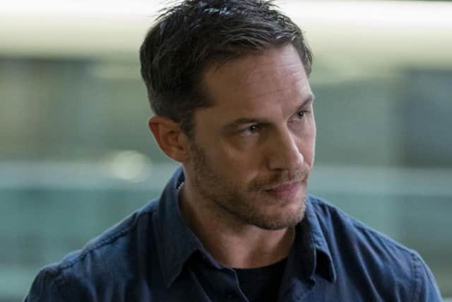 Tom Hardy plays Eddie Brock in Venom.