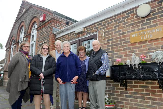 Amanda Stringer and Ruth Brewer with trustees David Todd, Margaret Lashly, Valerie Owen and Bob Francis outside the Westbourne Club. Picture: Sarah Standing (180756-5560)