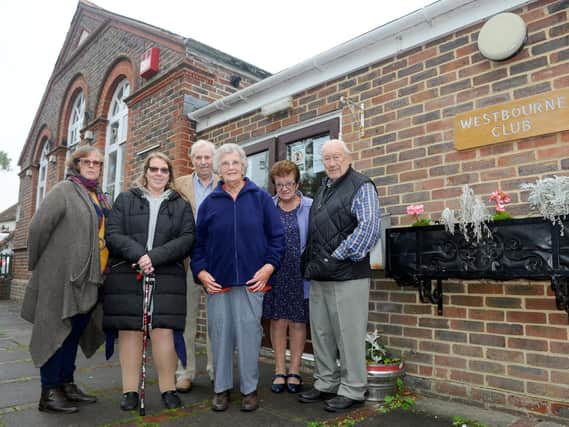 Amanda Stringer and Ruth Brewer with trustees David Todd, Margaret Lashly, Valerie Owen and Bob Francis outside the Westbourne Club. Picture: Sarah Standing (180756-5560)