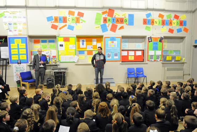 Sir Ben Ainslie giving a talk to pupils at Mayfield School, alongside long-standing teacher Matt Stedman
