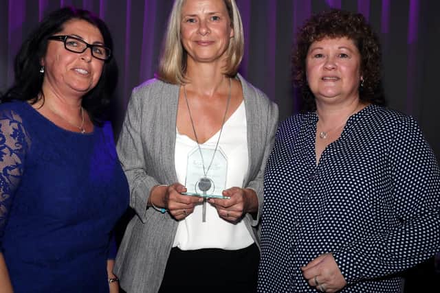 Nys Hardingham (left) presents the Inclusion award to the nurture team at Manor Infant School