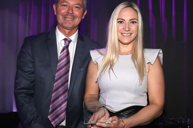 Simon Barrable presents the the Community award to Lucy Ellis from Northern Parade School
