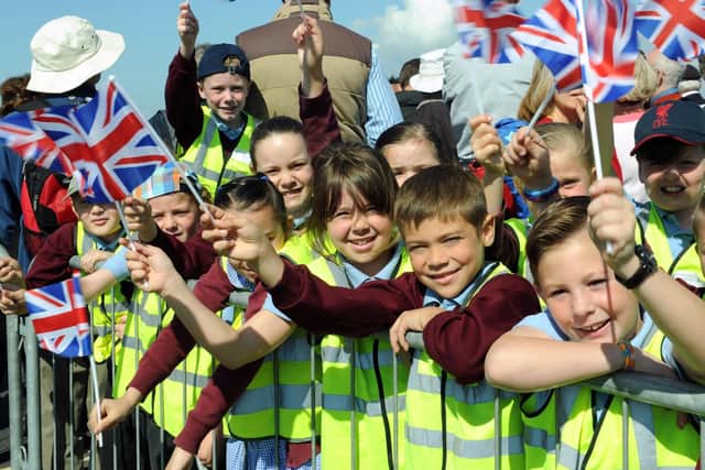 Children from Lyndhurst Junior School wave their flags at the D-Day 70 Drumhead service on Southsea Common in June, 2014
