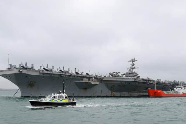 The US Nimitz-class aircraft carrier USS Harry S. Truman, following its arrival into Stokes Bay. Photo:  Andrew Matthews/PA Wire