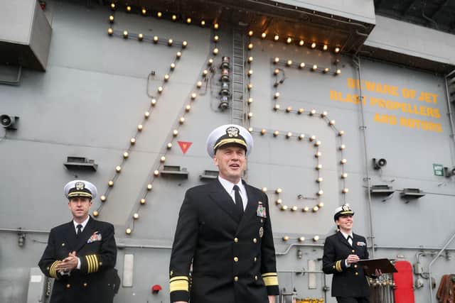 Rear Admiral Eugene H. "Gene" Black, Commander, Carrier Strike Group 8 (centre), and Captain Nicholas J. Dienna, Commanding Officer (left), on the flight deck of the US Nimitz-class aircraft carrier USS Harry S. Truman. Photo: Andrew Matthews/PA Wire