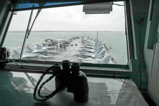 F-18 jets line up on USS Harry S Truman. Photo: Andrew Matthews/PA Wire