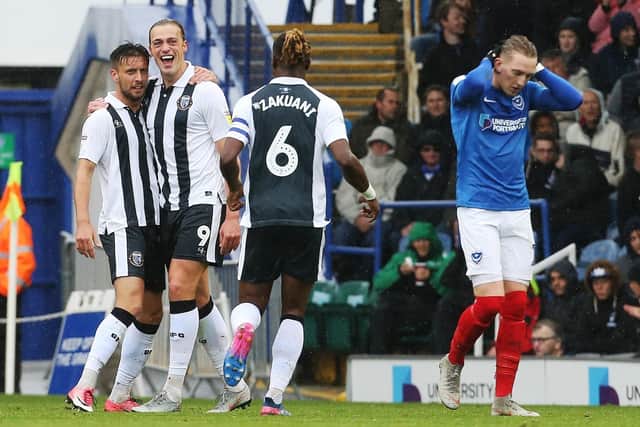 Tom Eaves, centre, celebrates his opener for Gillingham Picture: Joe Pepler