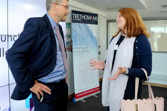 Mark Waldron, editor of The News, Portsmouth, talks to Becky Taylor, community investment associate at BAE Systems at the The News' Business Excellence Awards breakfast launch