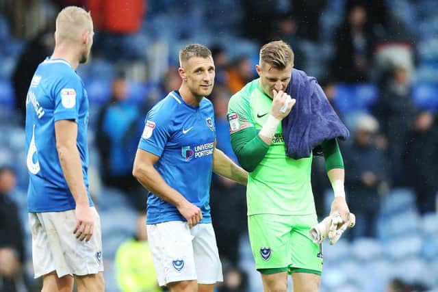Pompey's players reflect on a first league defeat of the campaign. Picture: Joe Pepler