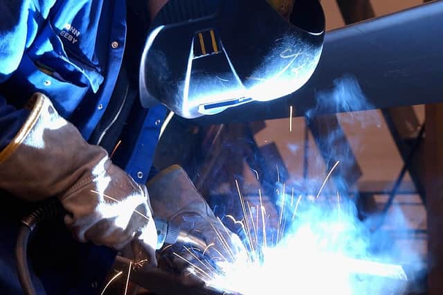 A welder works on the aircraft carrier in Portsmouth.
Photo: Ian Hargreaves