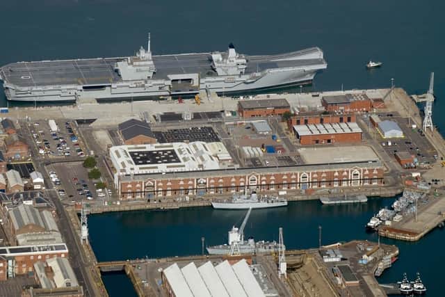 Aerial shot of Portsmouth Naval Base with HMS Queen Elizabeth alongside side, accompanied by a Type 45 destroyer 
Photo: Andrew Tyrrell / Ordnance Survey