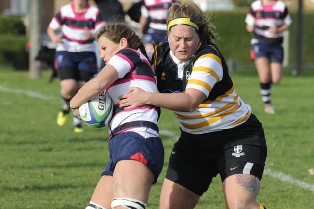 Havant's Daisy Atkinson is stopped in her tracks by Sandy Newsham. Picture: Ian Hargreaves