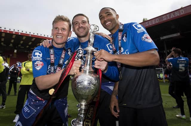 Brett Pitman celebrates with Matt Ritchie and Callum Wilson after securing the Championship trophy