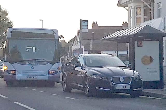 A First bus service pulls round the Portsmouth City Council mayoral car, a Jaguar XF Luxury, parked in a bus stop in London Road on September 29. Picture: Habibur Rahman
