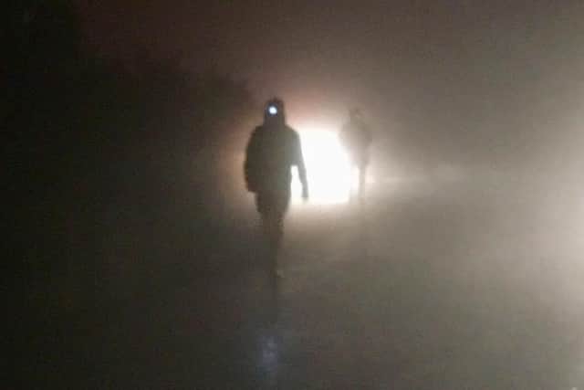 Russell Tullett running through Storm Zorba at night