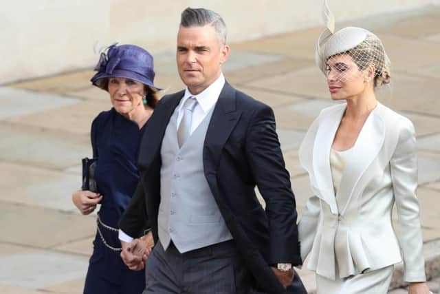 Robbie Williams and Ayda Field (right) arrives for the wedding of Princess Eugenie to Jack Brooksbank at St George's Chapel in Windsor Castle. Picture: Aaron Chown/PA