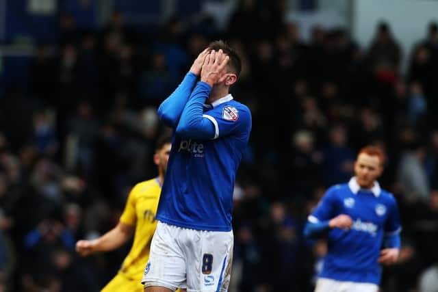 Jed Wallace dejected after blazing a spot-kick over the bar against Exeter. Picture: Joe Pepler